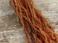 Clear Iridescent Ochre 3mm Rondelle Beads #85: Single strand or 10 strand pack